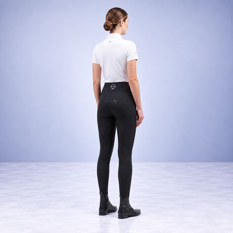 Black riding tights from behind with full silicone seat and waistband logo