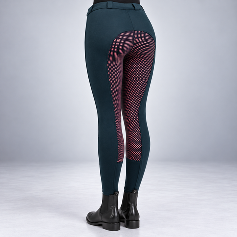 Navy two tone jodhpurs with pink dotted silicone seat worn with jodhpur boots
