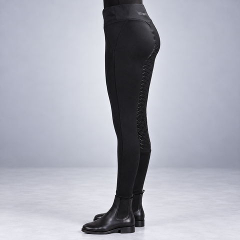 Black high waist riding tights with silicone seat worn with ankle boots